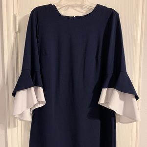 Navy knee length long sleeve dress with white flowy cuffs size 12.